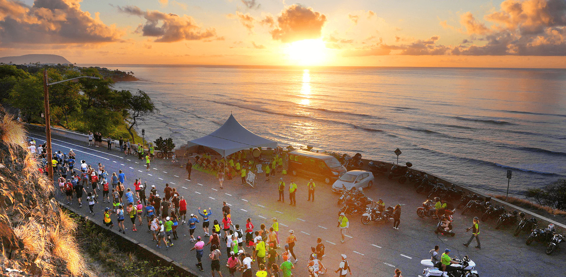 Honolulu runners on the coastal race route at sunrise